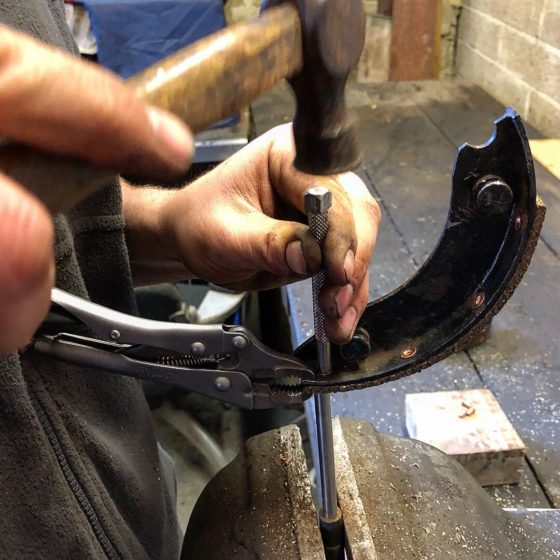 Charlie relining a brake shoe from an Austin Seven Ruby at Wight Classics